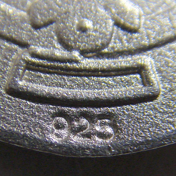 (p1362)Circular silver medal motif San Benito.